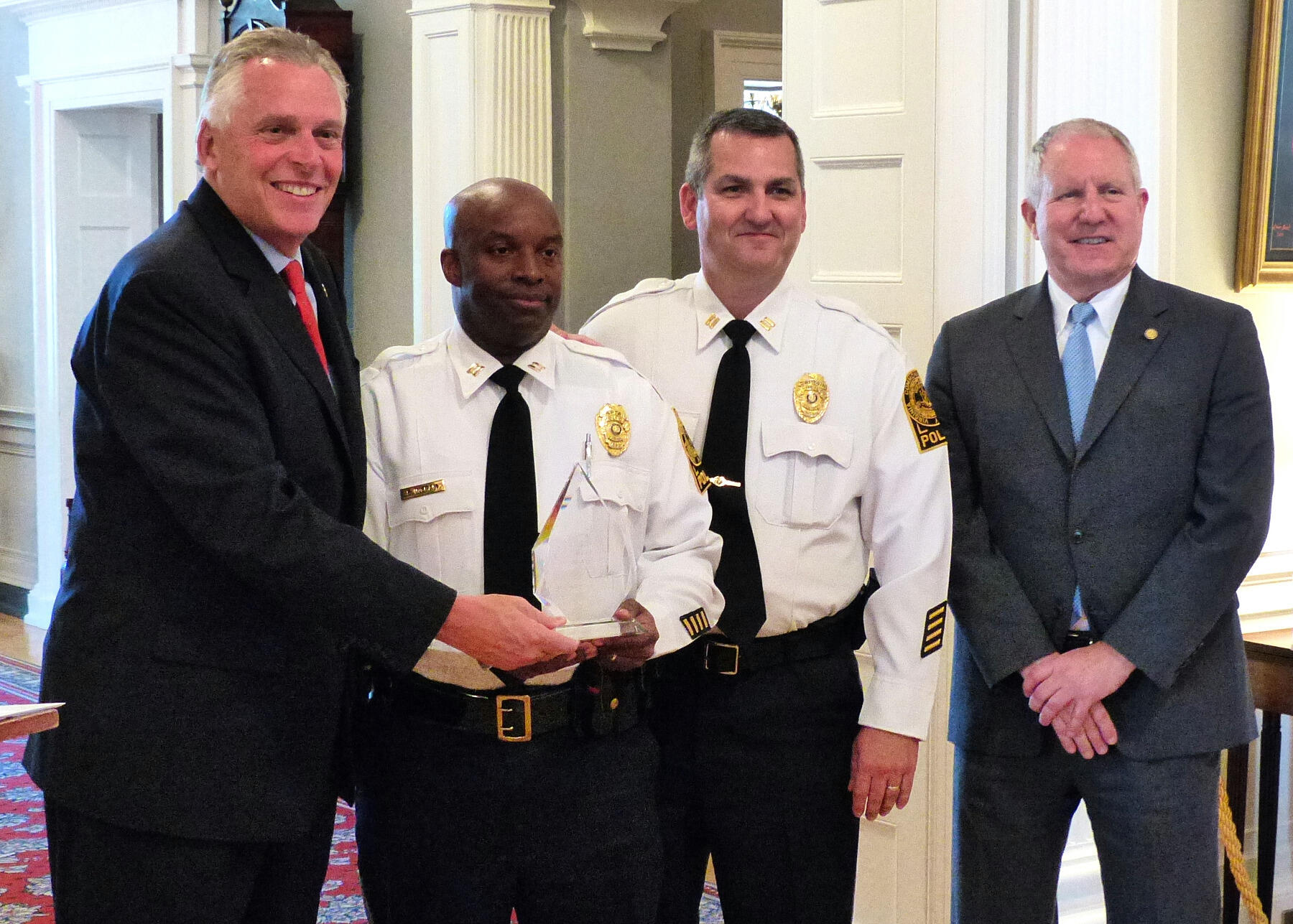  From left: Gov. Terry McAuliffe, VCU Police Capt. Sean Ingram, VCU Police Capt. Howard “Mike” O’Berry and Commissioner Richard Holcomb, Virginia Department of Motor Vehicles.