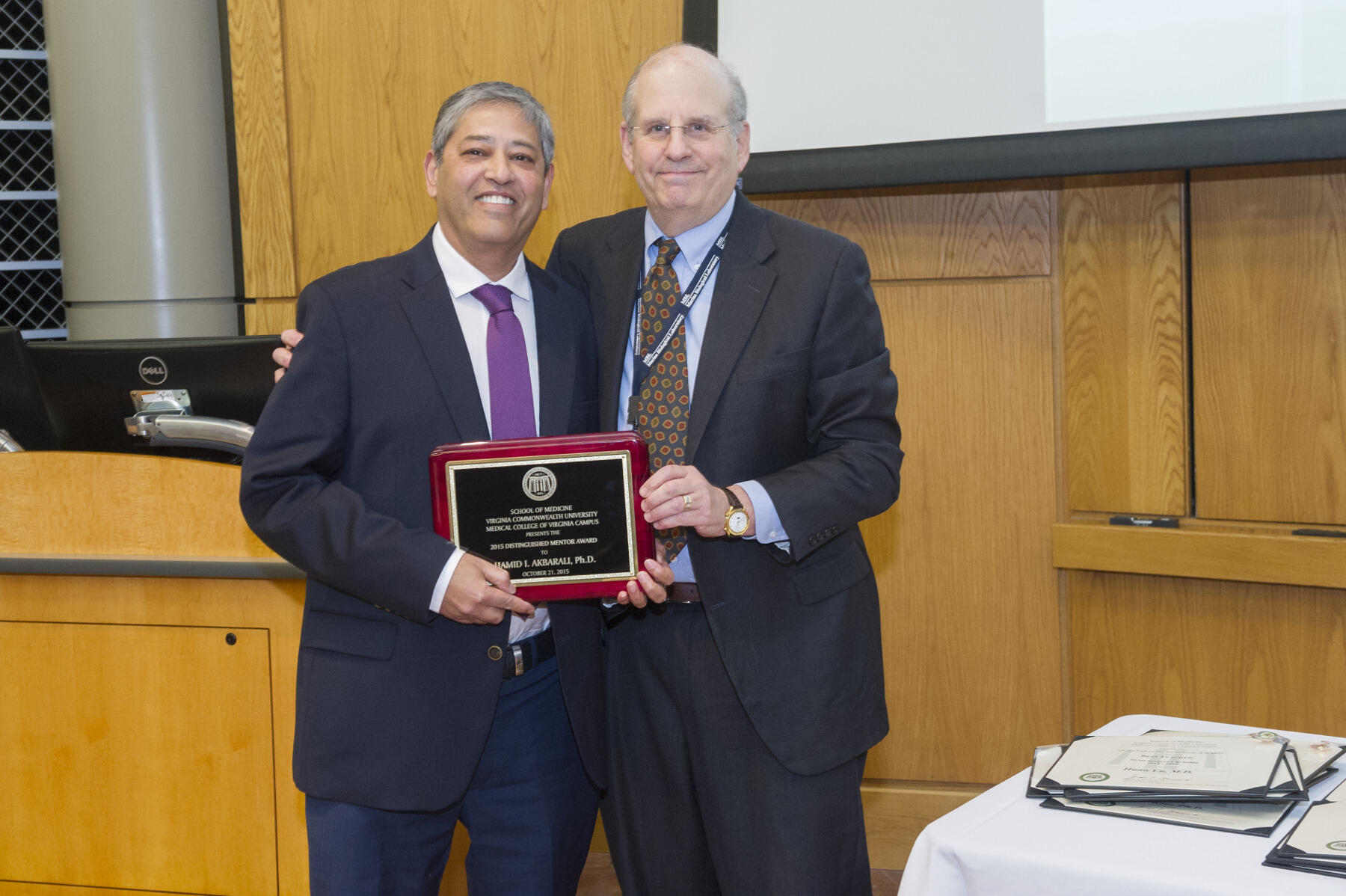 This year’s Distinguished Mentor Award went to Hamid I. Akbarali (left), Ph.D., professor in the Department of Pharmacology and Toxicology.  Jerome Strauss (right), M.D., Ph.D., dean of the VCU School of Medicine, presented the award.  