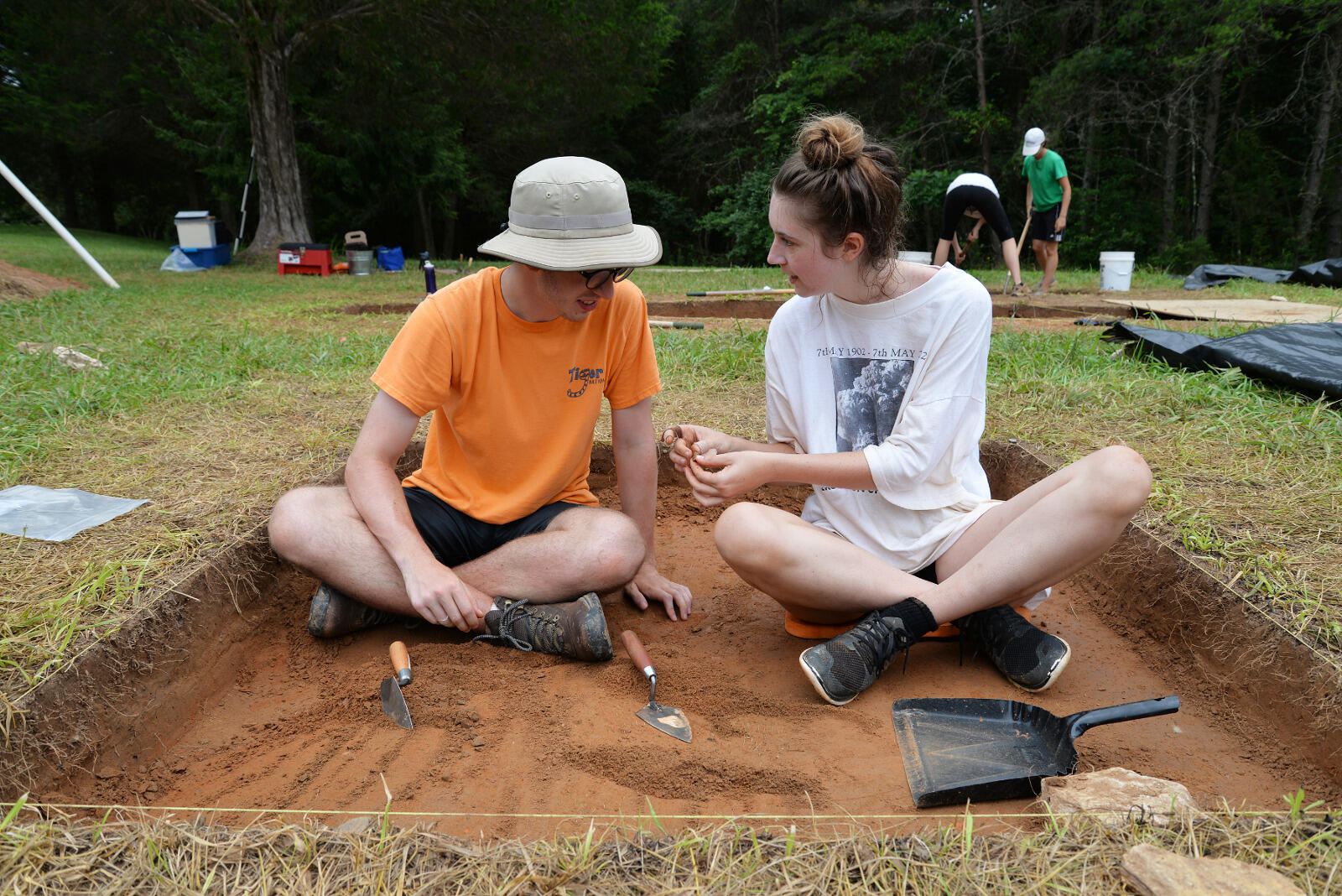 VCU anthropology students Ben Snyder and Marianne Tokarz check out a piece of a pipe stem they discovered while excavating a section of the Fort Germanna/Enchanted Castle site.