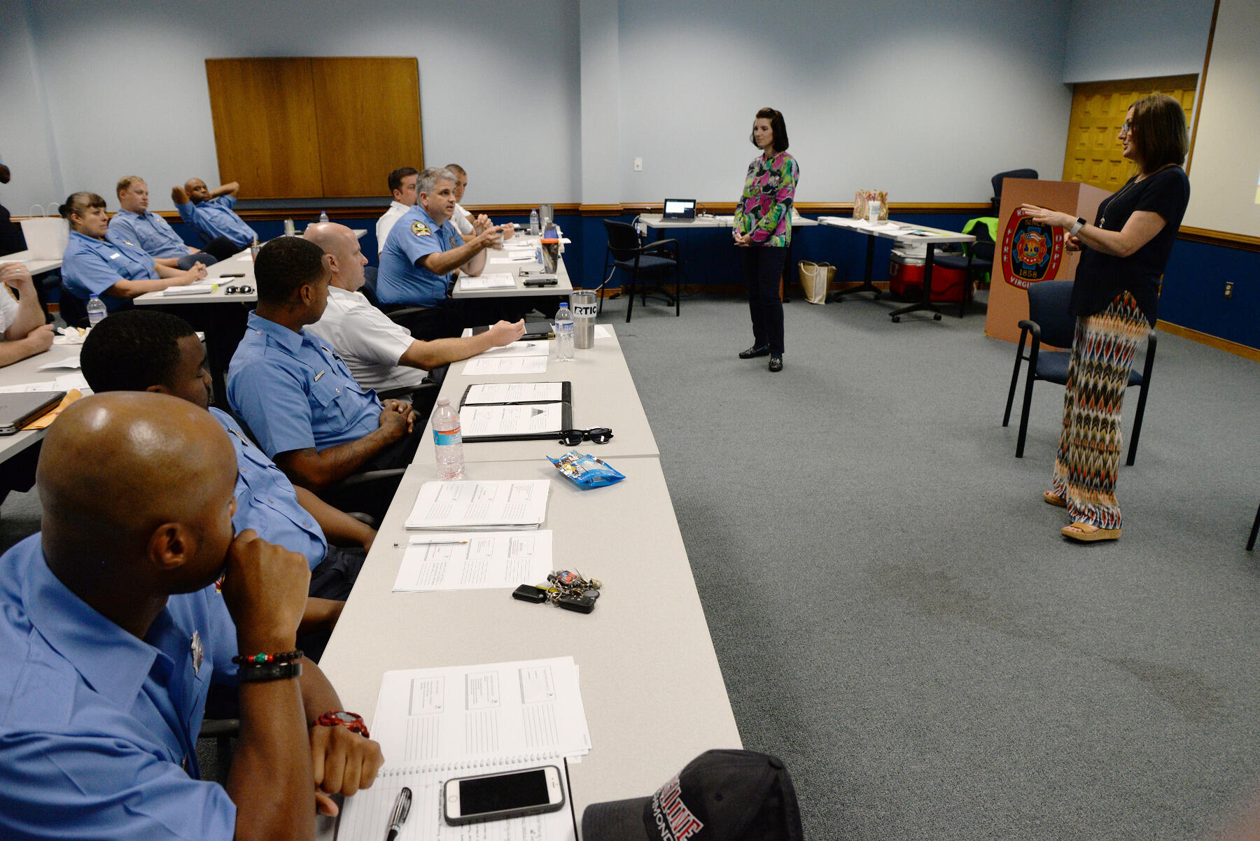 Donna Gibson, Ph.D., a professor in the School of Education, and Mary Beth Heller, Ph.D., an assistant professor in the Department of Psychology, train Richmond firefighters in how to be an effective peer supporter.
