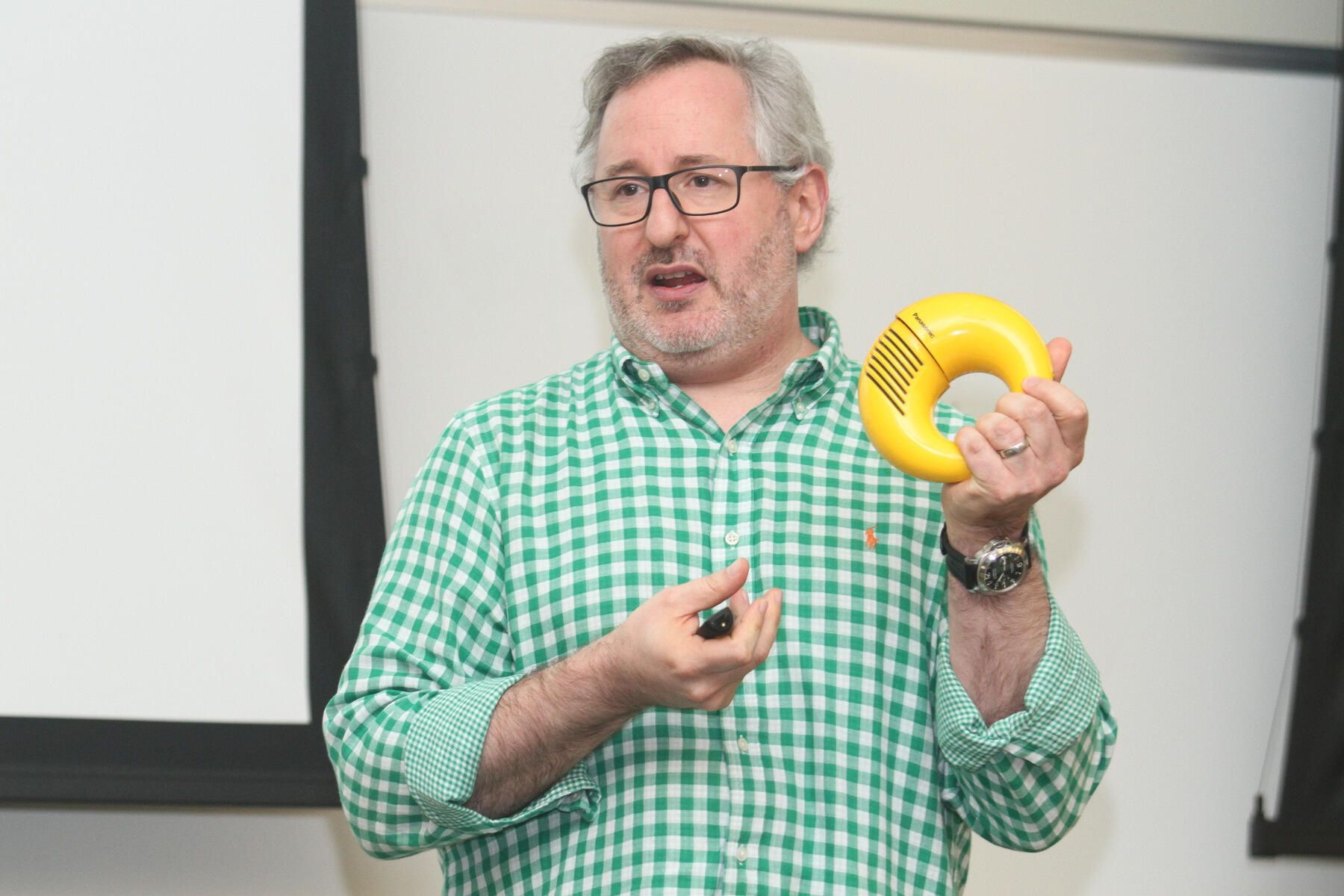 Craig Dubitsky, founder and CEO of Hello Products, models a 1970s Panasonic R72 wearable radio while speaking to a marketing class at the Virginia Commonwealth University School of Business.
<br>Photos by Pat Kane, University Public Affairs