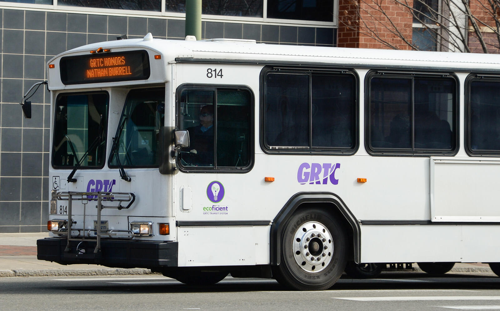 A GRTC bus displays Burrell's name.