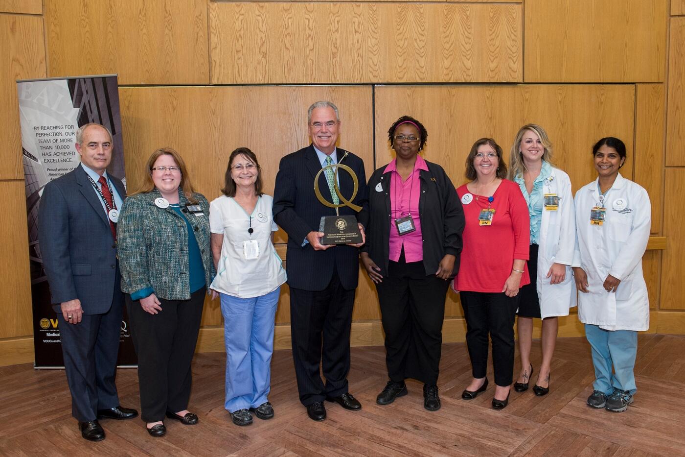 Photo courtesy of University Relations. From left to right: Chris Graham, 2013 Employee of the Year; Susan Beavers, 2010 Employee of the Year; Janet Holloway, 2008 Employee of the Year; Rich Umbdenstock, President and CEO, American Hospital Association; Peaches Brooks-Davis, Safety Star; Karla Batten, 2007 Employee of the Year; Tessa Gaddy Lauter, Safety Star; Theresa Padinjarekuttu, Safety Coach and Safety Star.
