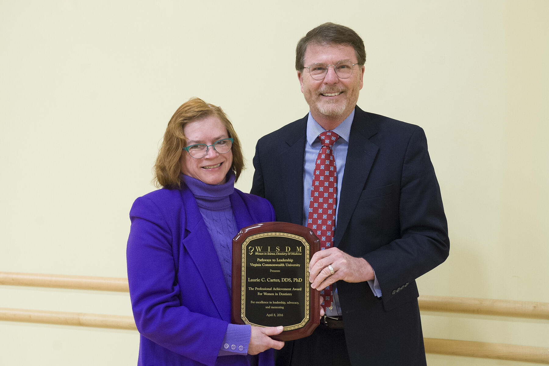 Laurie C. Carter, D.D.S., Ph.D., (left) accepted the WISDM Professional Achievement Award this year from VCU School of Dentistry Dean David Sarrett, D.M.D. Photo by Thomas Kojcsich, University Marketing.