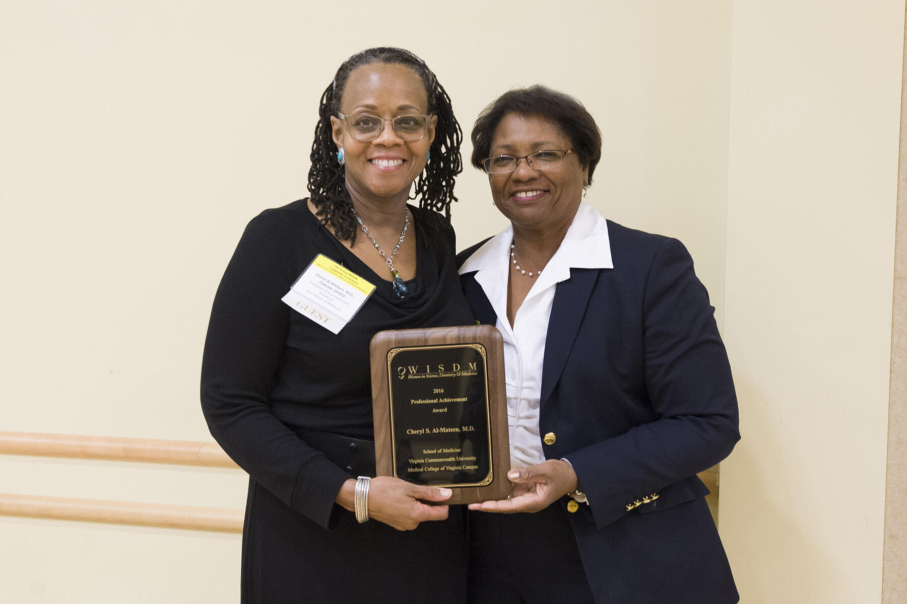 Cheryl S. Al-Mateen, M.D., (left) was one of the women honored with the WISDM Professional Achievement Award at this year’s conference. PonJola Coney, M.D., (right) presented the award. Photo by Thomas Kojcsich, University Marketing.