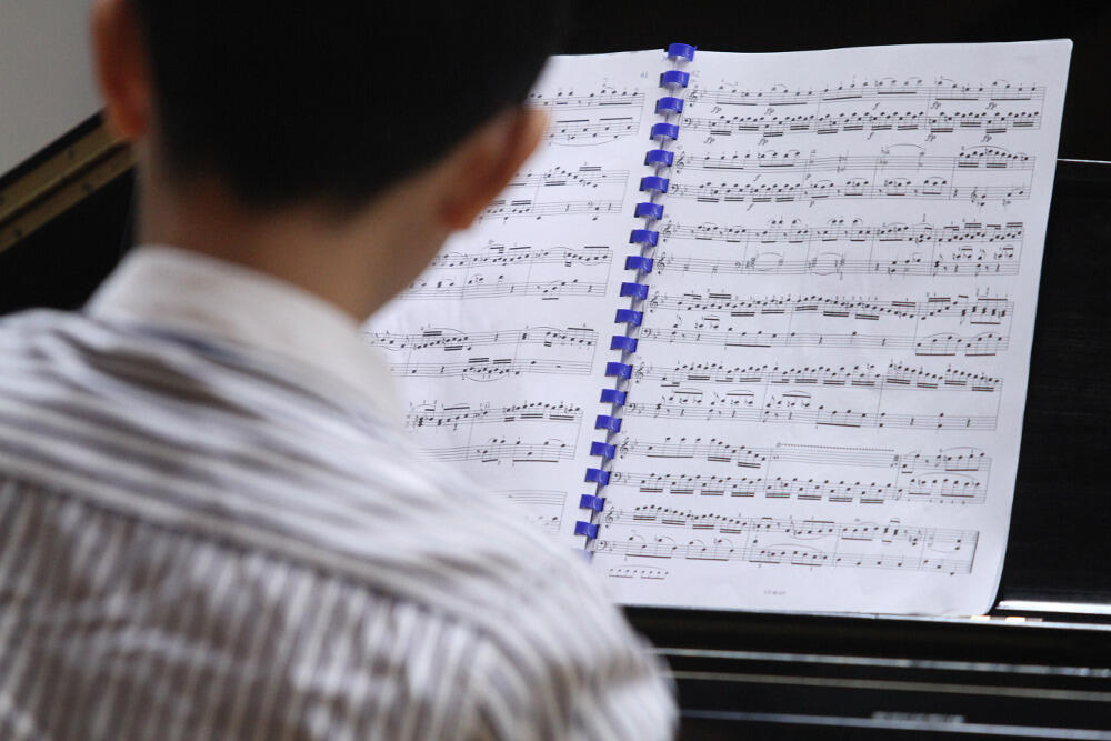 A student takes his turn in a piano master class during the VCU Global Summer Institute of Music.