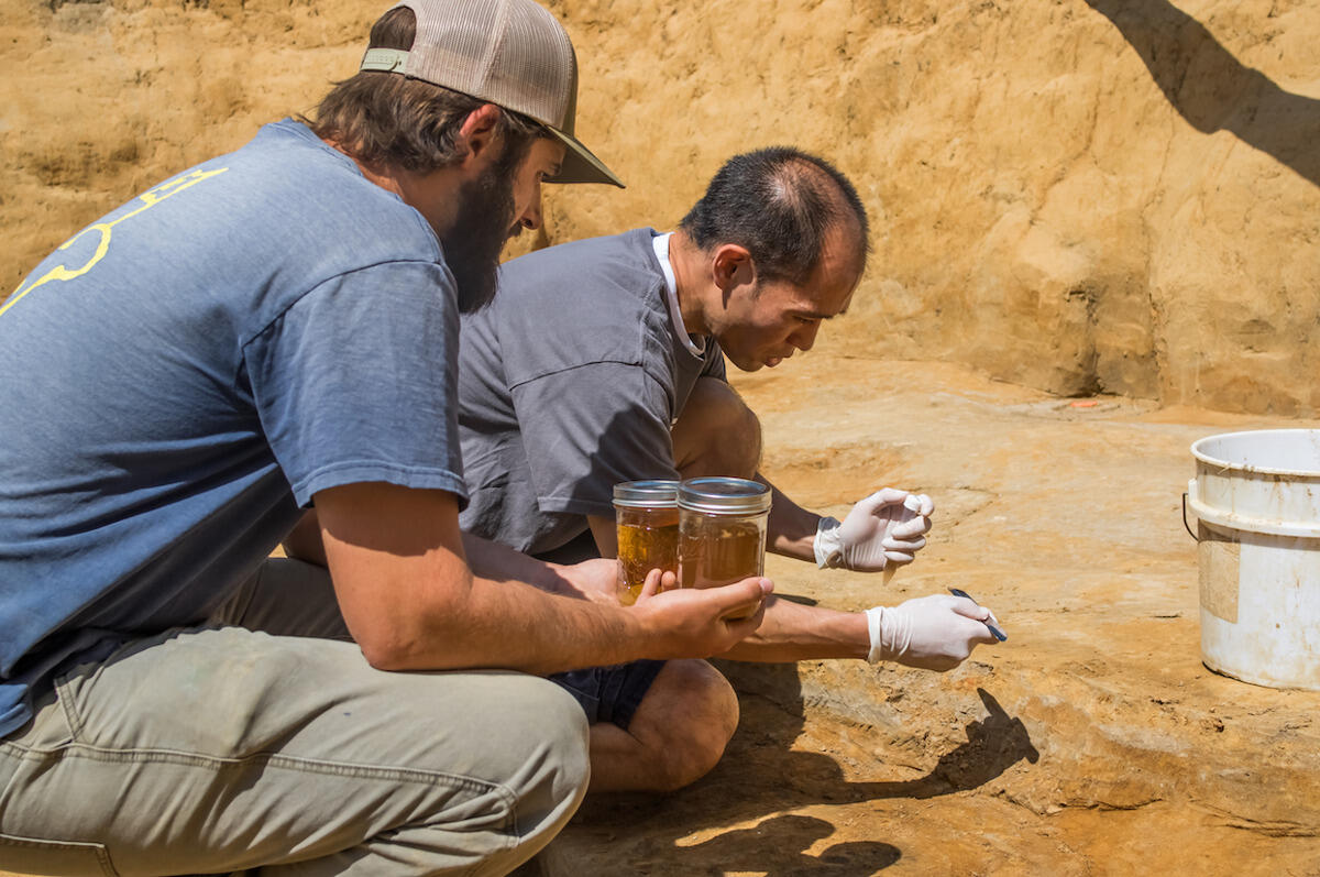 Stephen S. Fong, Ph.D., associate professor and vice chair, Department of Chemical and Life Science Engineering, right, gathers samples from the Jamestown site.