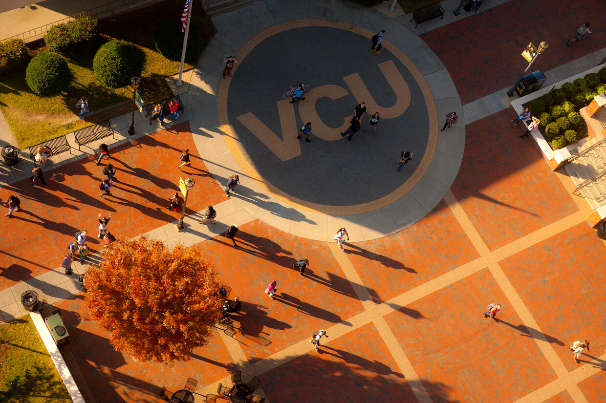 An areal view of the VCU Student Commons plaza with people walking across it. 