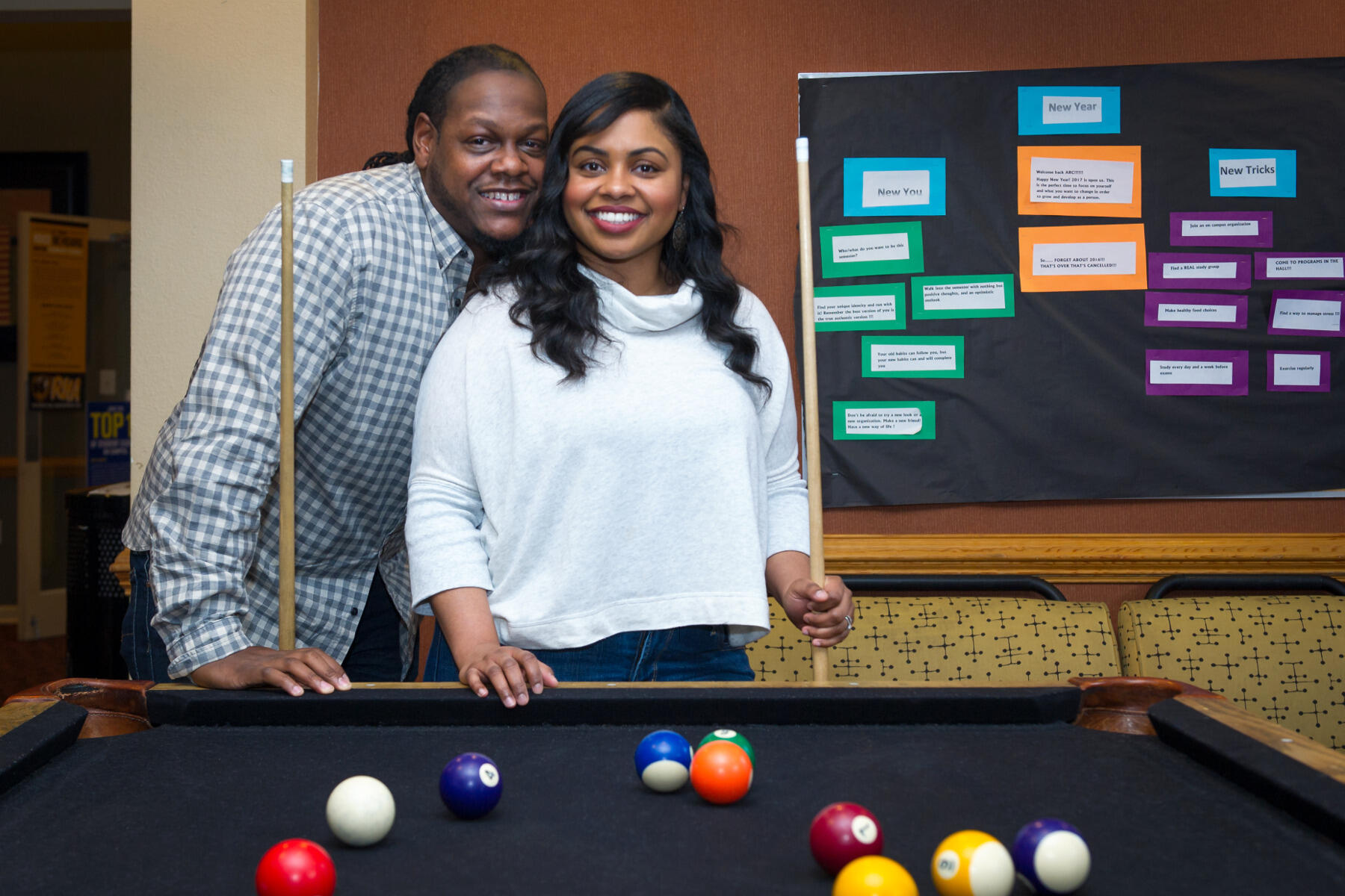 Dwayne and Tierney Jackson in the lounge area of Ackell Residence Center (known as West Broad Apartments when they lived there), where according to Tierney, “Dwayne put the moves on me during a game of pool.” 
