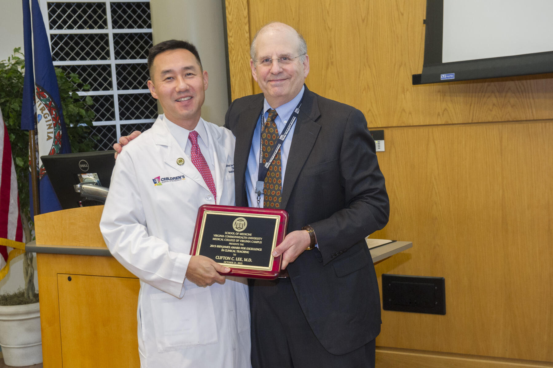 Clifton C. Lee (left), M.D., associate professor in the Department of Pediatrics and chief co-director of the pediatric clerkship at the Children’s Hospital of Richmond at VCU, was one of two recipients to win the Irby-James Award for Excellence in Clinical Teaching. Jerome Strauss (right), M.D., Ph.D., dean of the VCU School of Medicine, presented the award.  