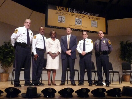 Presiding over the VCU Police Academy 35th Basic Law Enforcement Academy Exercises:  From left, VCU Police Capt. David Q. Welch; VCU Interim Police Chief Col. Carlton G. Edwards; Judge Cleo E. Powell; Senior Vice President for Finance and Administration John M. Bennett; Academy Director Capt. Grant J. Warren; and Assistant Academy Director Sgt. William L. Butters. Photo by Mike Porter, VCU Office of University Communications and Public Relations.