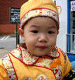 Two-year old Leo Chen, whose family owns the Good Taste Buffet on Grace Street, also participated in the festival wearing traditional ceremonial Chinese garb.