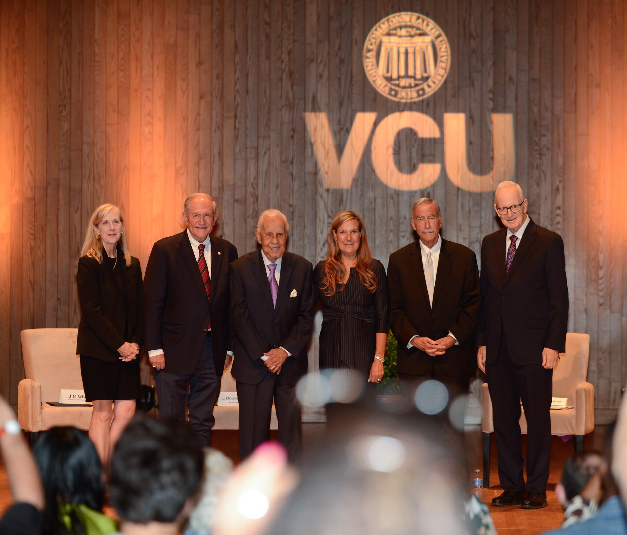 A group photo of six people standing. 