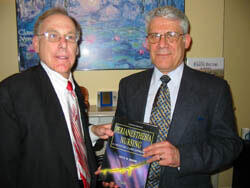 Dr. Hermes A. Kontos, vice president for Health Sciences and CEO of the VCU Health System, accepts an autographed copy of "Perianesthesia Nursing: a Critical Care Approach," the new 4th edition text book authored by Dr. Cecil B. Drain, dean of the VCU School of Allied Health Professions.

Photo by Michael Ford, University News Services