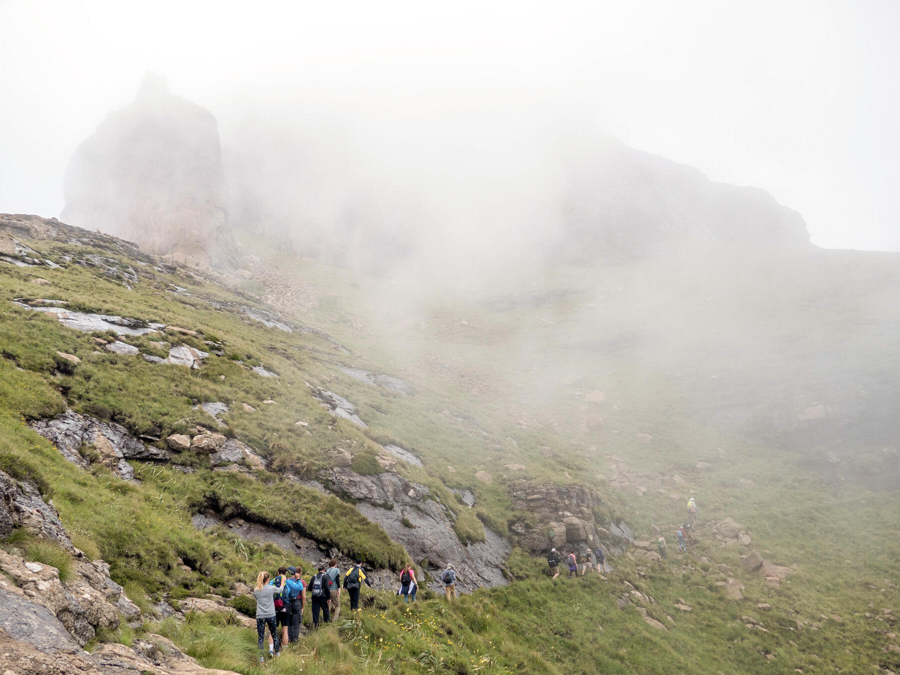 Summits to Seas students hike through the mist of the Drakensbergs.
<br>Photo by James Vonesh.