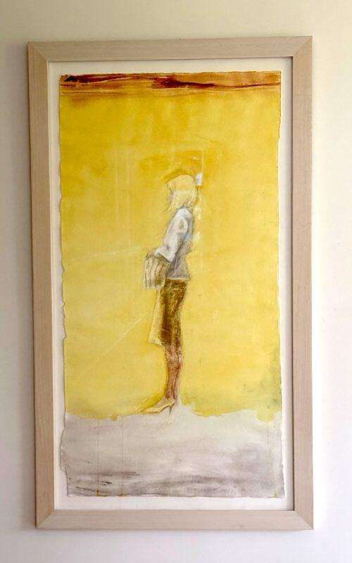A painting of the profile of a woman standing. 