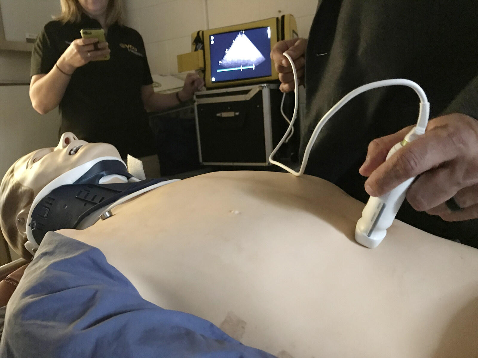 Jason Welch, M.D., an EMS physician and medical director for Operational Medicine Consultants, uses an ultrasound probe as part of a simulated exercise in VCU Health's course on using ultrasound in pre-hospital emergency medical care.
