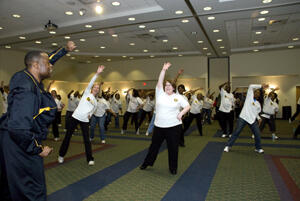Dr. Eric West leads participants in a warm up before the walk begins. Photo by Melissa Gordon, VCU Communications and Public Relations