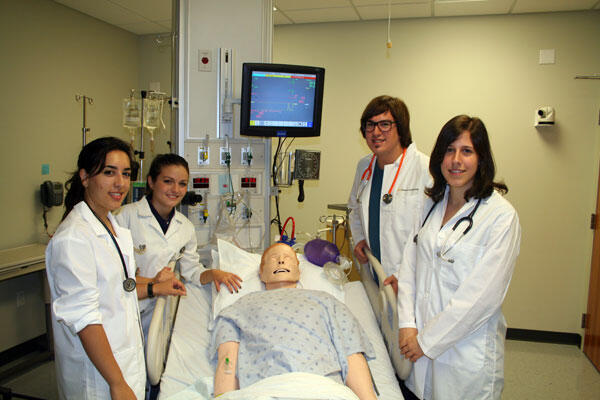 (From left to right) University of Cordoba students Isabel Maria Martin de Almagro Gazas, Marina Hermoso de Mendoza Ayuso, David Herrera Sanz and Irene Minano Fernandez in the simulation lab at the School of Nursing's Clinical Learning Center. 