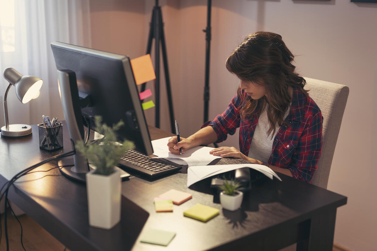 Woman sitting at a desk and working.