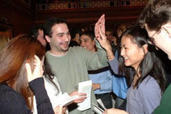 From left: Ali Hashemi and Christine Huynh high-five after opening their envelopes while other fellow students look on.

Photos by Nancy Parker