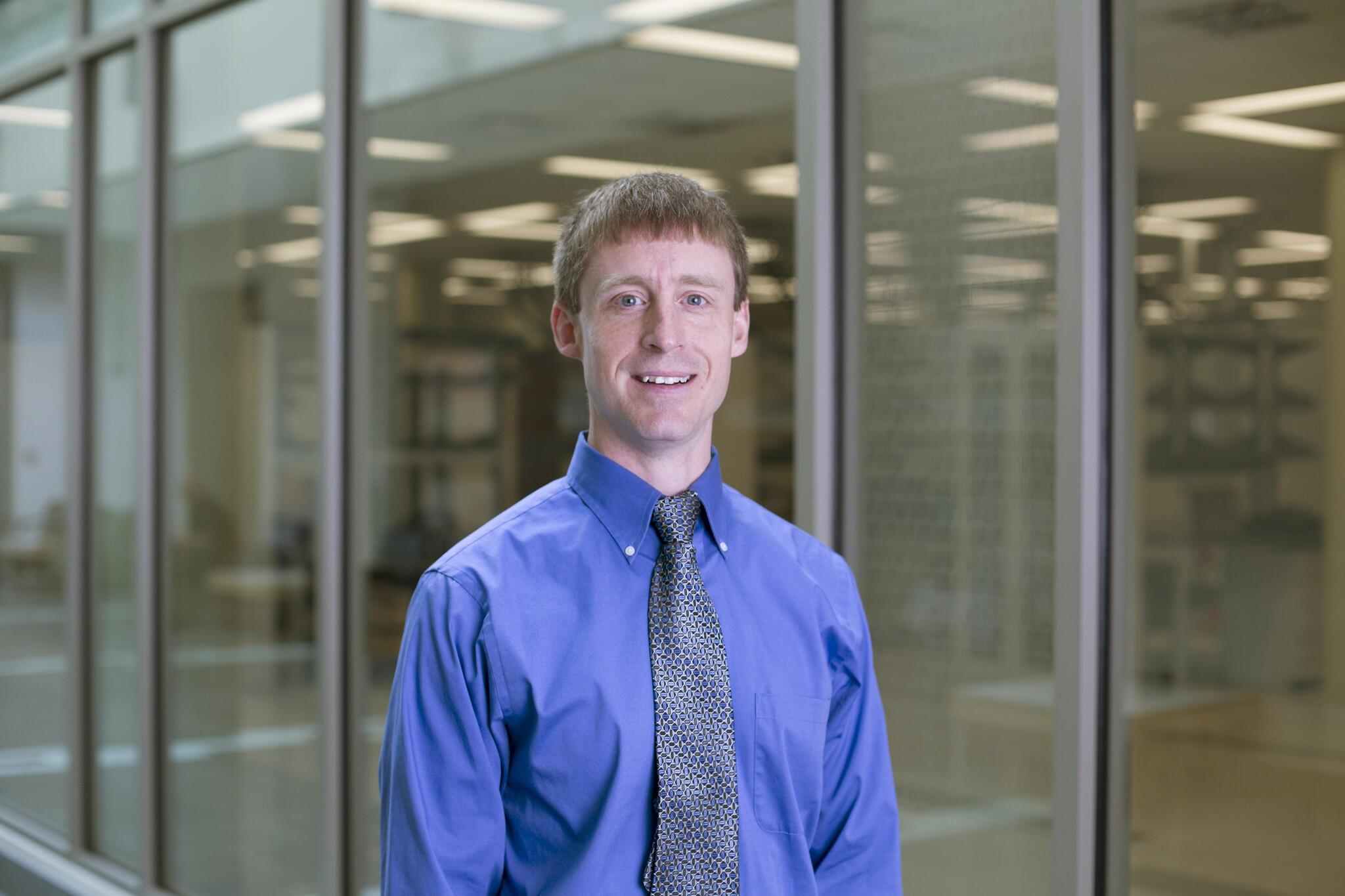 A photo of a man from the chest up. 