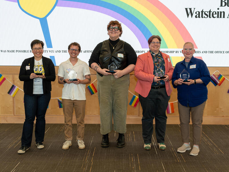 A group photo of five people. 