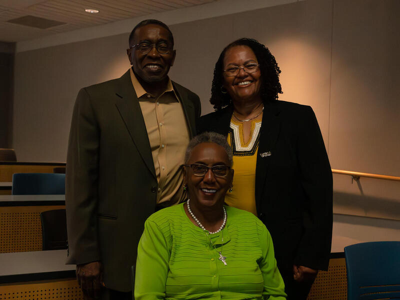 Christopher Brooks, Ph.D., (standing left), Naomi Hodge-Muse (seated) and Faye Z. Belgrave, Ph.D., chief diversity officer and vice president for inclusive excellence, at a recent event celebrating "Tales of Koehler Hollow," a book co-authored by Hodge-Muse and Brooks. (Photo by Mylia Wentworth)