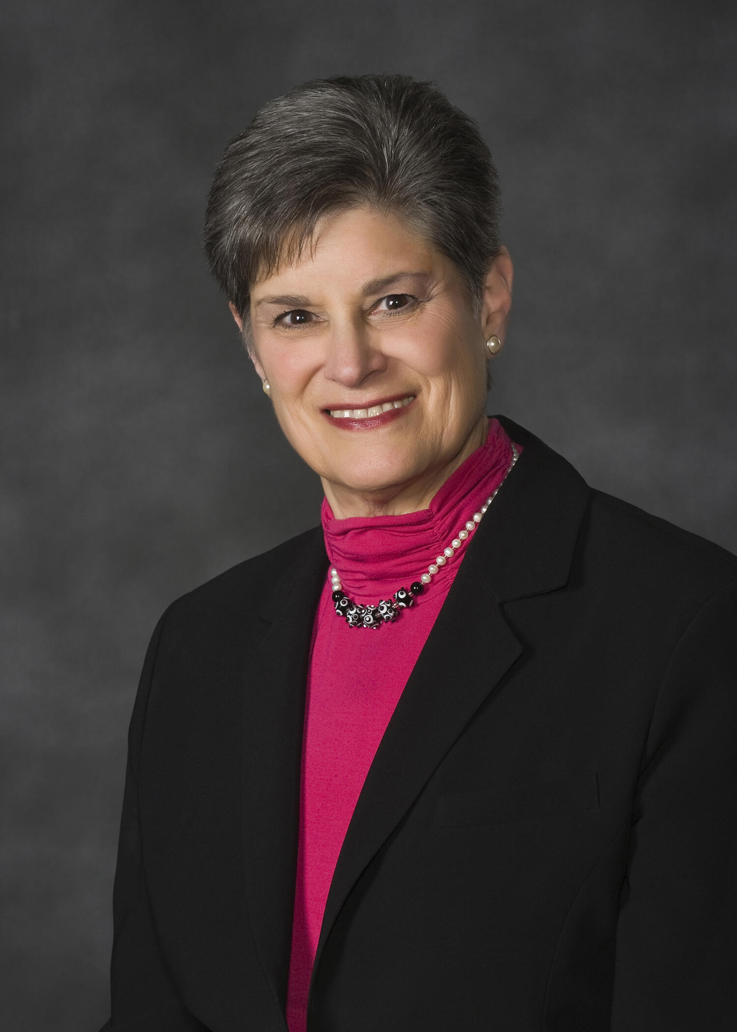 A photo of a woman from the chest up. 