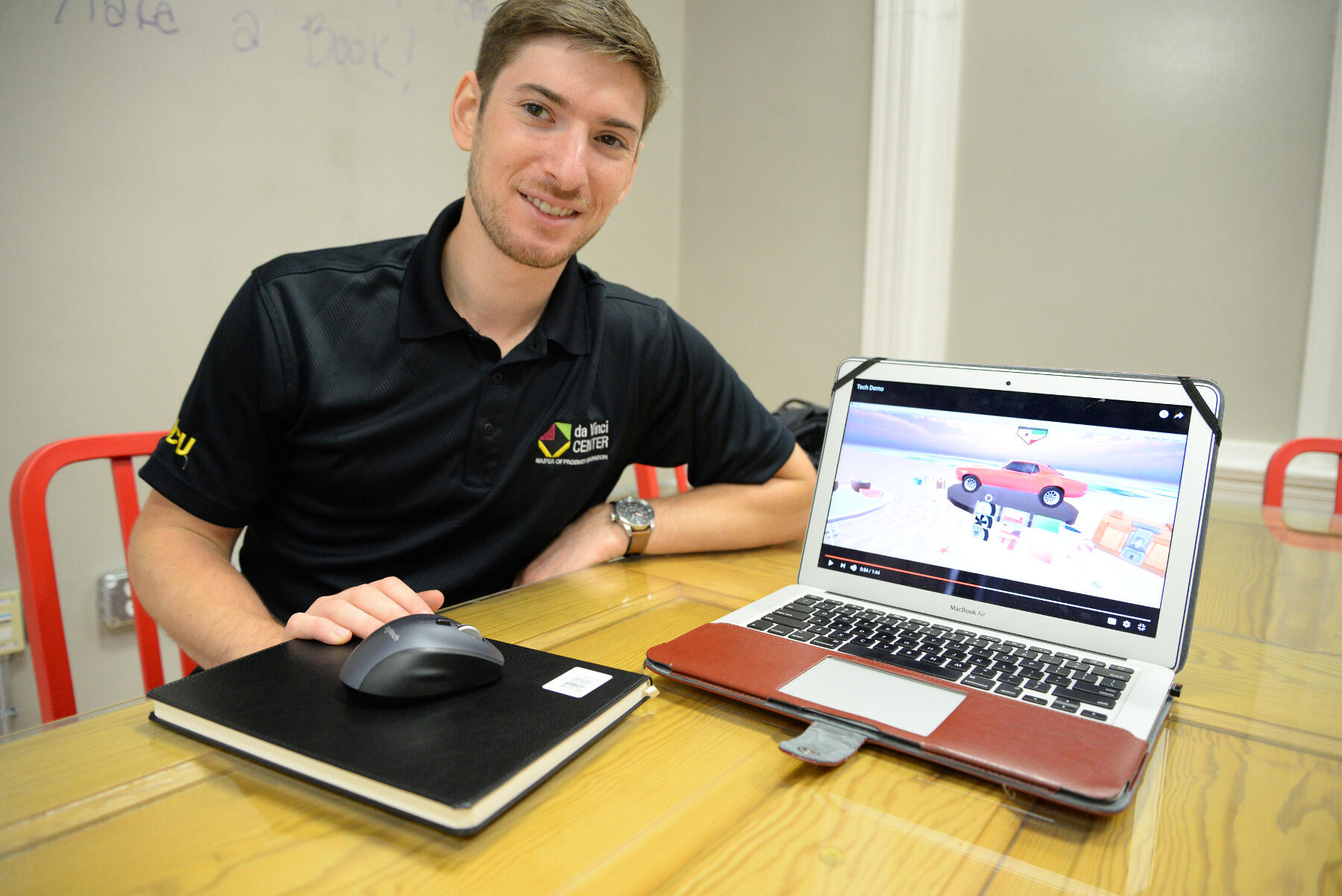 Matthew Halpern, a Master of Product Innovation student in VCU's da Vinci Center, displays his team's prototype virtual reality advertising prototype, which allows virtual reality users to customize a car.
<br>Photo by Brian McNeill, University Public Affairs
