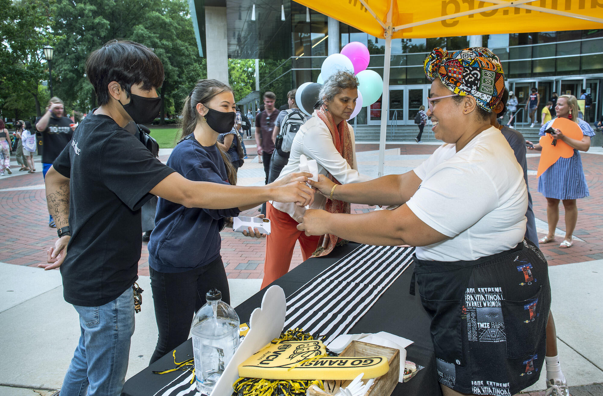 Rabia Kamara handing out ice cream at a VCU alumni event in September