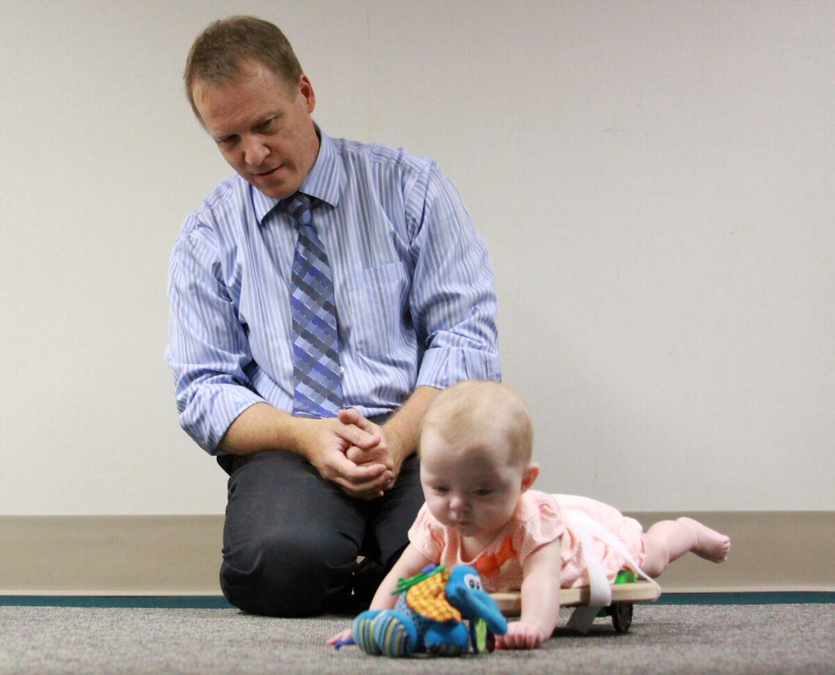 Peter Pidcoe, D.P.T., Ph.D., demonstrates the SIPPC with the help of a baby who was not involved in SIPPC research.