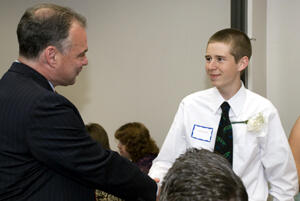 Virginia Gov. Timothy Kaine congratulates cancer survivor Jacob Eck at the 2009 graduation celebration. Photo by Melissa Gordon, VCU Communcations and Public Relations.