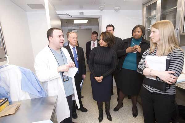 Antonio Abbate, M.D. assistant professor of medicine, (in white coat) speaks to representatives of the American Heart Association. The American Heart Association staff and Board of Directors received a tour of the newly renovated Pauley Heart Center Laboratory earlier this month. Before the tour, the VCU Pauley Heart Center <a href="http://news.vcu.edu/news/VCU_Pauley_Heart_Center_Receives_American_Heart_Association_Grant">received $2.4 million in grant funding from the  American Heart Association Mid-Atlantic Affiliate</a> to support 12 research projects. 
