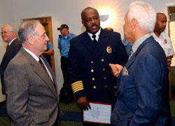 Front from left: Eugene P. Trani, VCU president, Larry R. Tunstall, Richmond fire chief and director of the Department of Fire and Emergency Services and L. Douglas Wilder, distinguished professor in VCU's Center for Public Policy, share a few words during the Appreciation Breakfast.