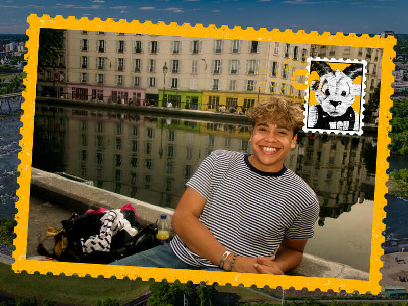 A postcard with a photo of a man sitting next to the Seine River in Paris
