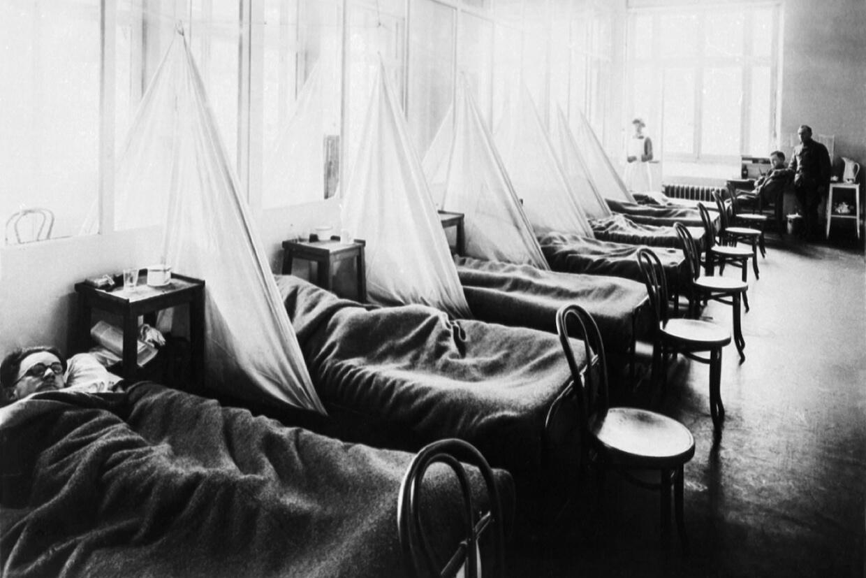 Patients in hospital beds at influenza ward No. 1 at a U.S. Army camp hospital in Aix-Les-Bains, France, 1918.