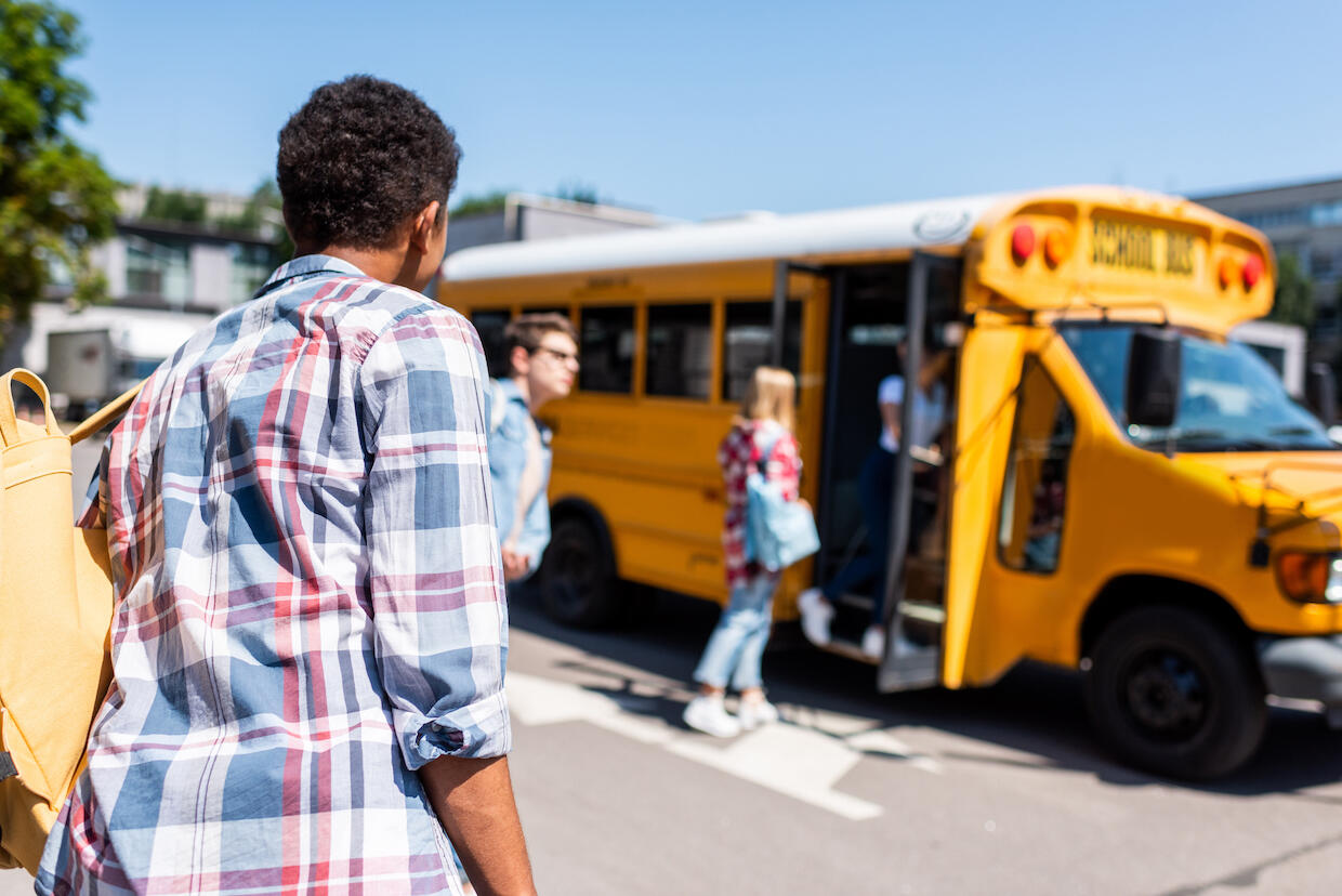 Students boarding a school bus.