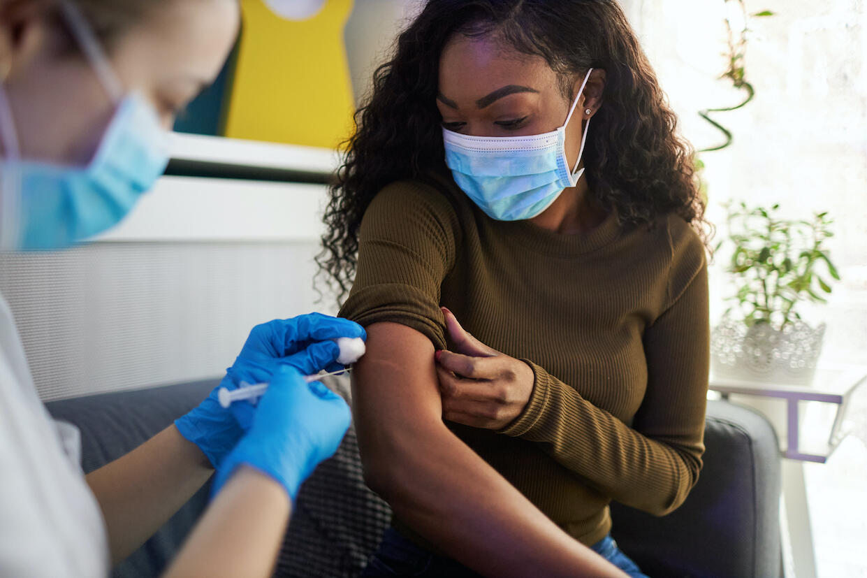 black woman getting vaccinated