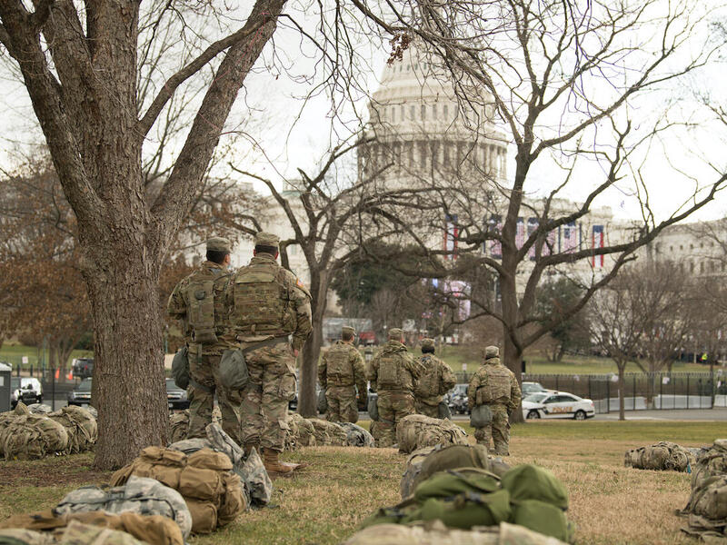 Soldiers in the Virginia National Guard look toward the U.S. Capitol building as they secure the area around the presidential inauguration on Jan. 20 At least 25,000 soldiers were authorized to conduct security, communication and logistical missions in January. Among them were several with connections to VCU. (Photo by Bryan Myhr)