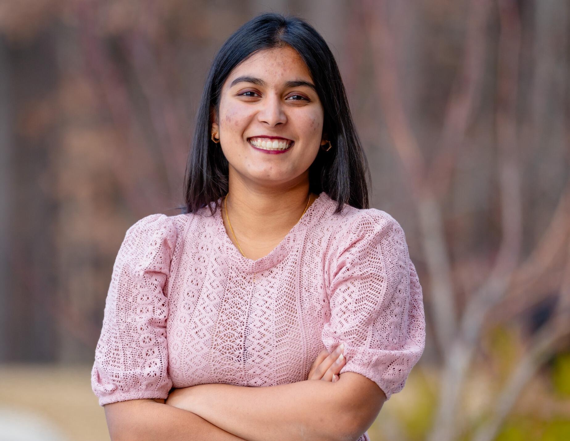 A photo of a woman from the shoulders up. 