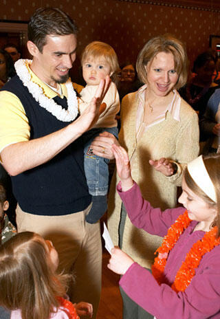 The Villamagnas share high-fives after opening Drew's Match Day envelope.

Photos by Nancy Parker, Expressions Photography