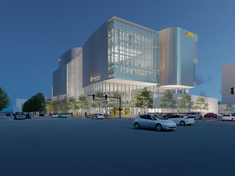 A 3D rendering of a large building on the side of a busy road. 