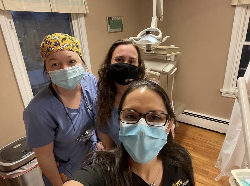 Samantha smith standing in a dental room with two other people