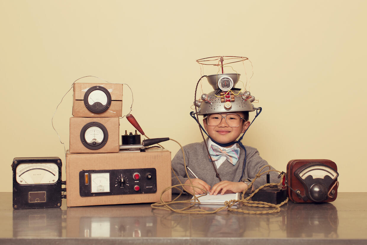 A child wearing a helmet hooked up to measuring equipment.