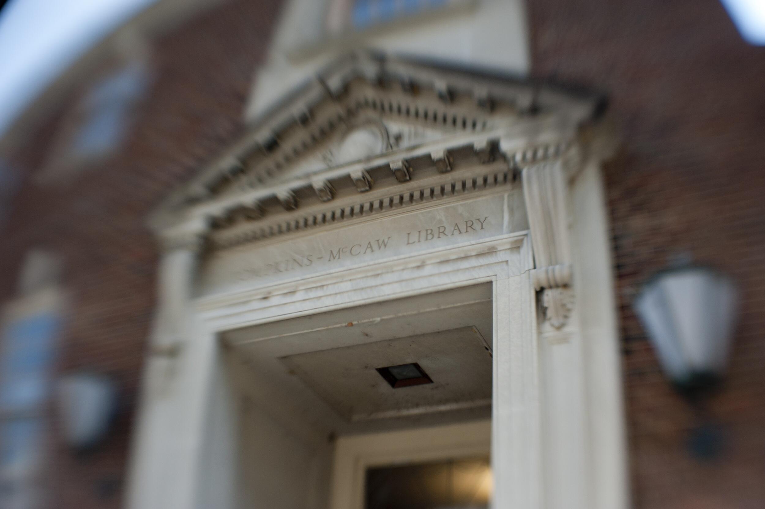 A doorway with a sign noting the Tompkins-McCaw Library on the M C V campus of V C U.