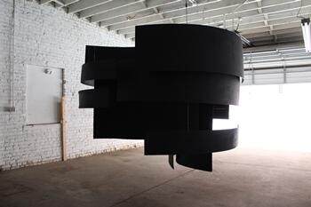 A previous piece by Mariam Eqbal, a kinetic imaging M.F.A. candidate. Eqbal's piece in the MFA Exhibitions, Part II, will resemble this work, using curved black wood panels suspended from the ceiling.