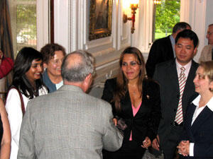  VCU President Eugene P. Trani, Ph. D., welcomes Dr. Giselle Gonzalez, from Panama City, Panama, as other fellows look on. Gonzalez is currently director of the Department of Dentistry at a large public hospital and plans to incorporate what she learns here into her work back home. Photo by: Mike Porter/VCU News Services