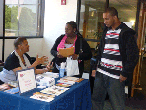 From left: Gale Rose, human resources recruiter, VCU Health System, talks with Evetta Bolling of Mechanicsville and Harvey Johnson of Richmond. Photo by Mike Porter, Office of Communications and Public Relations.