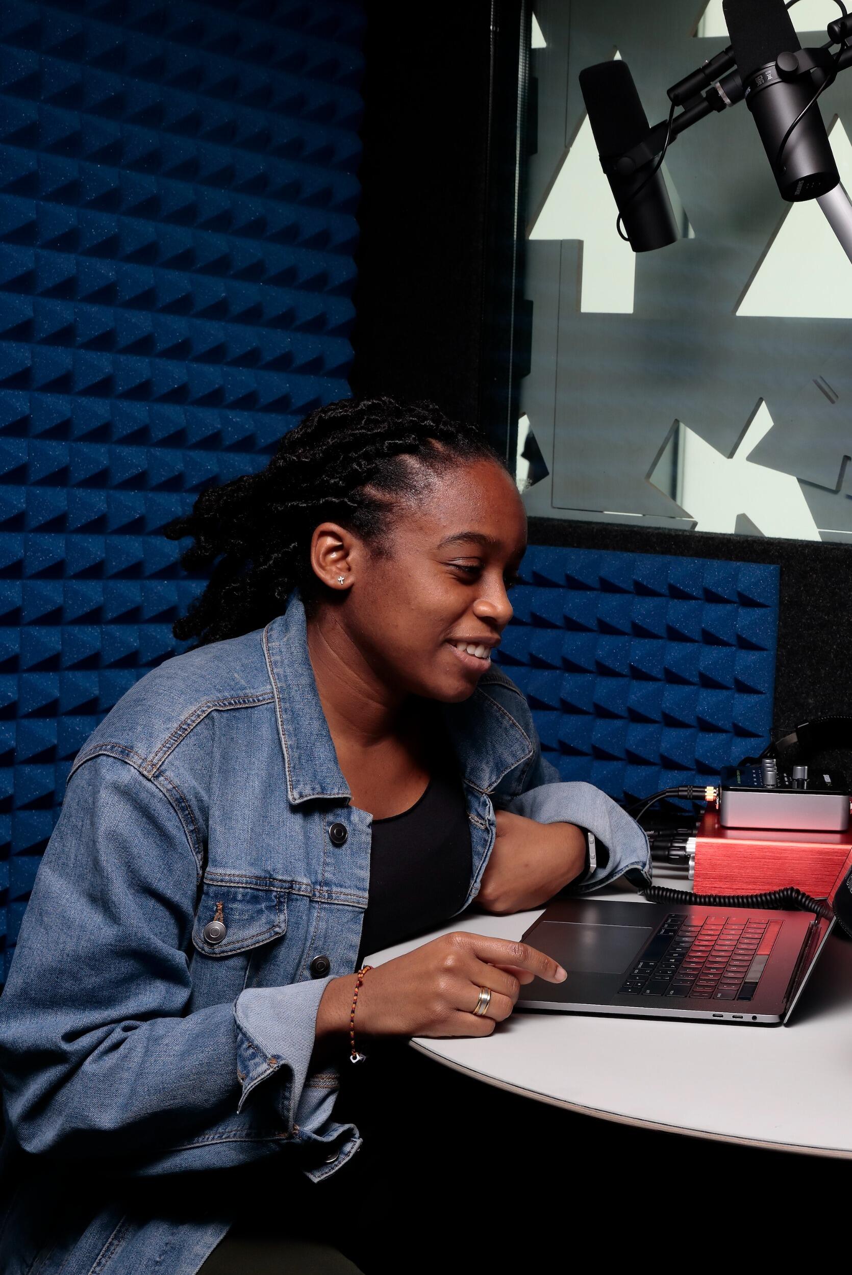 Young woman Inside one of the VPM+ICA Community Media Center's recording studios.